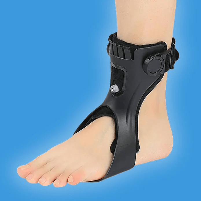 A close-up of a foot wearing a black ankle brace on a blue background.